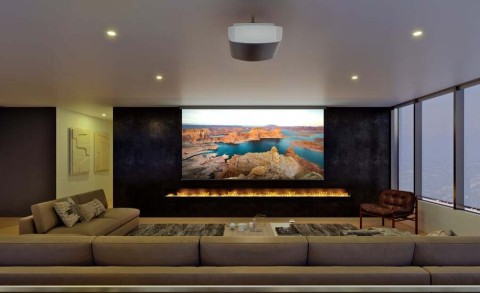 A luxury home theater with a projector displaying a river landscape.