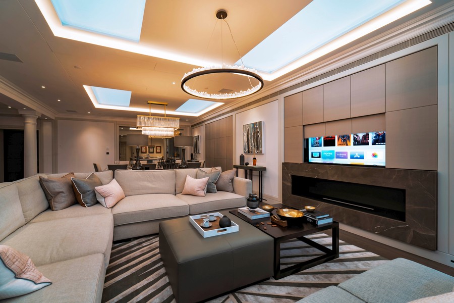 A living room with a hidden display using Future Automation technology and in-ceiling speakers. 